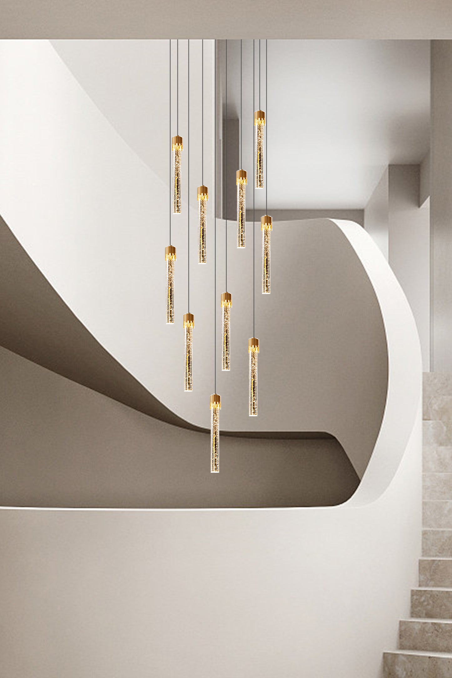 Grand staircase with a dazzling gold bubble crystal pendant light, lighting up the space beautifully.