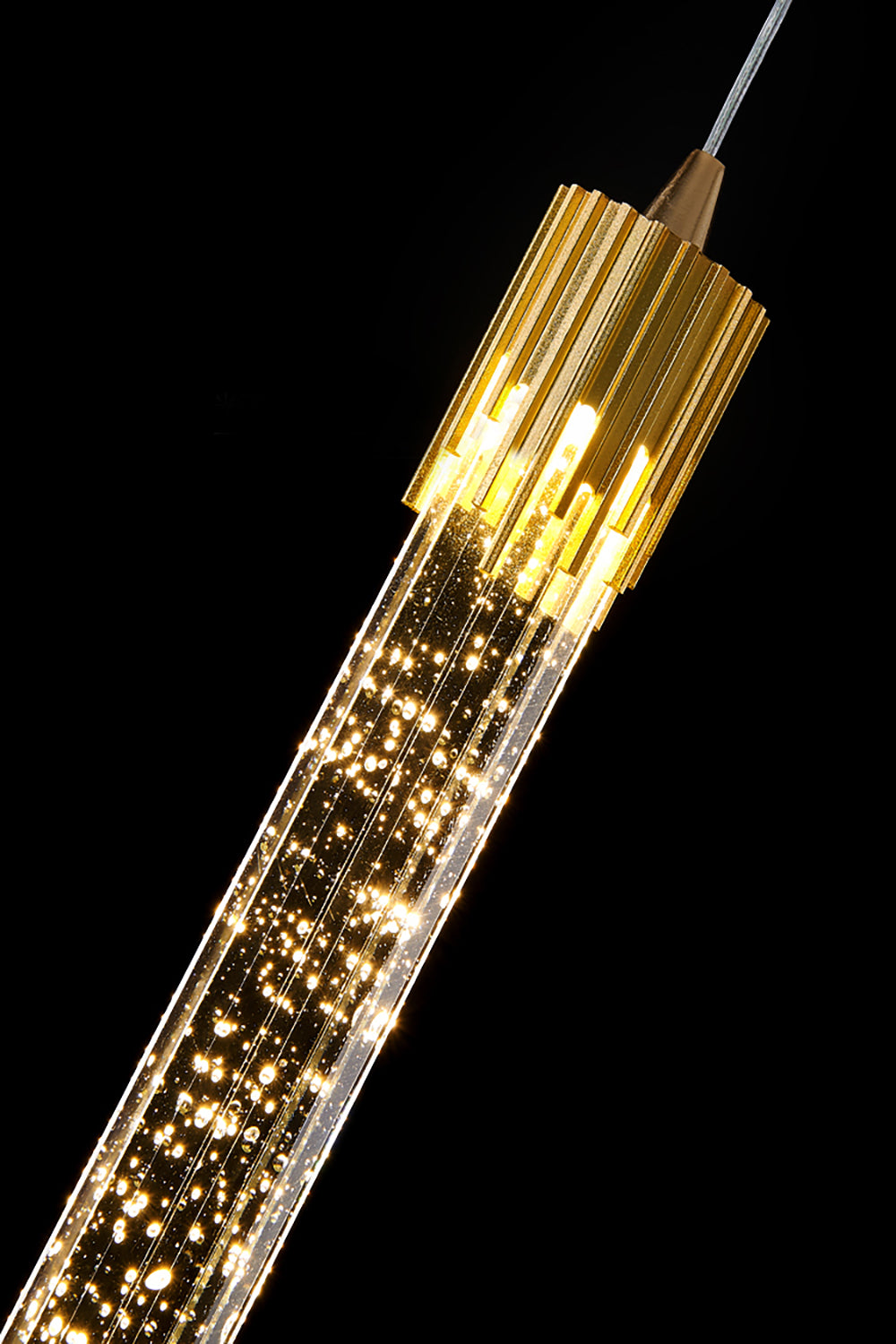  Long-stemmed light bulb shining in gold hue.