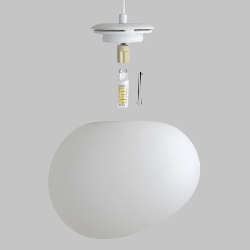 Close-up of a single white oval glass globe from the Gleesia Oval Glass Chandelier with a metal fitting, on a grey background.