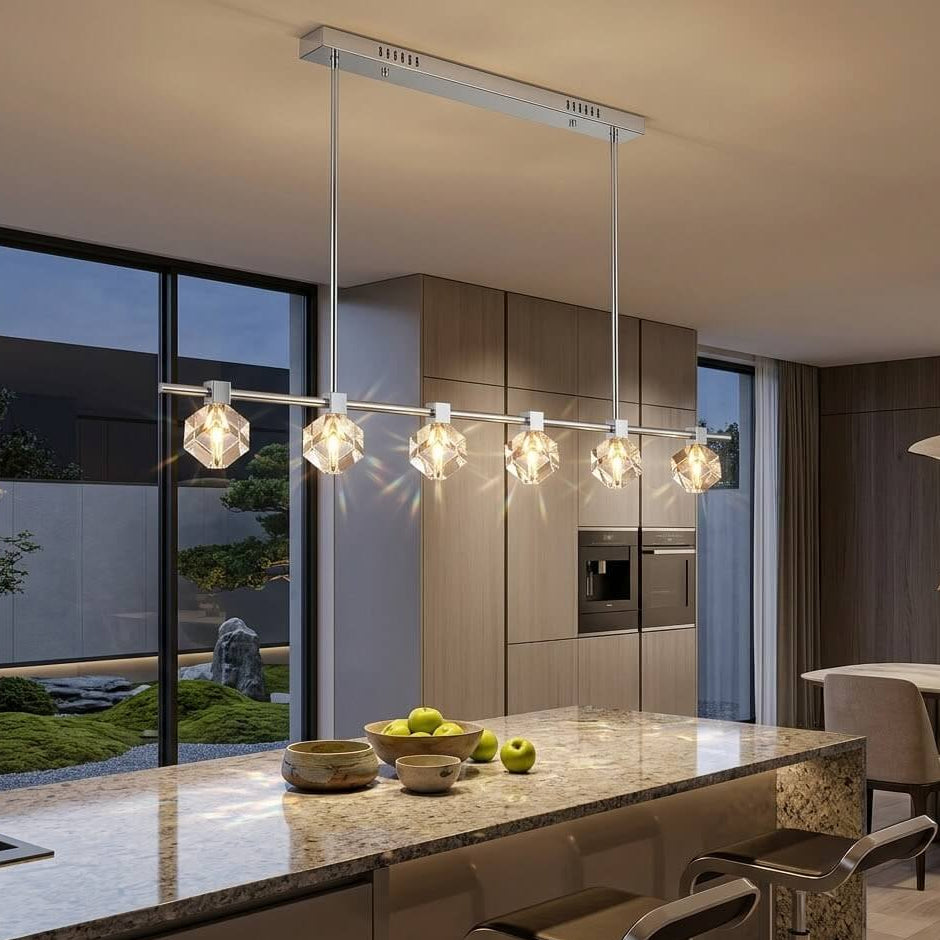 Modern kitchen with pendant lights and a view of a garden.